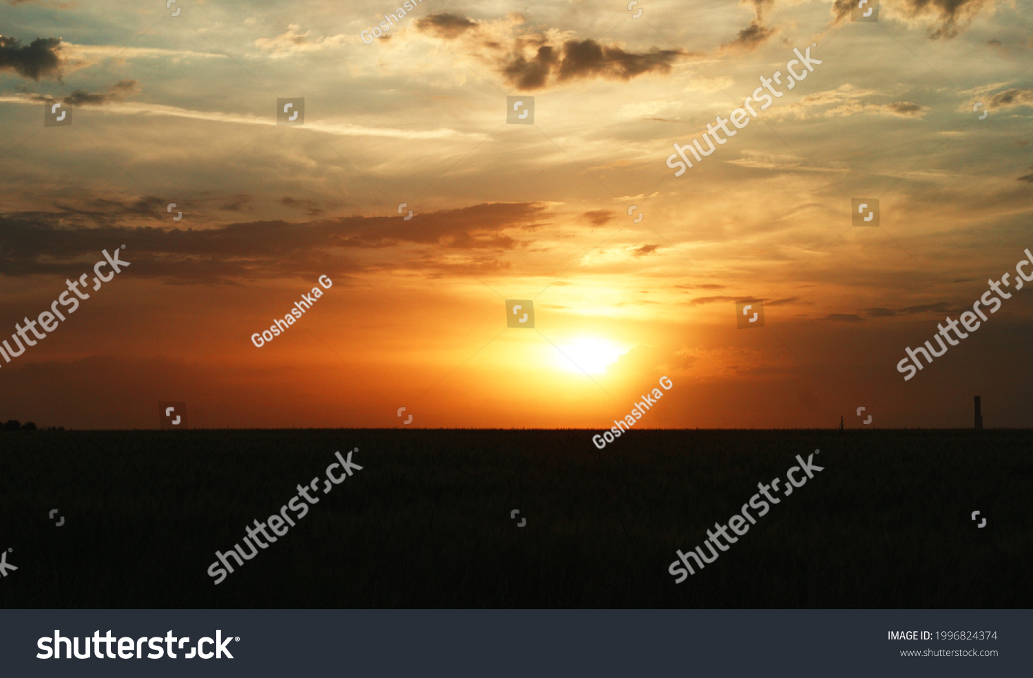 Dramatic sunset and sunrise sky with colorful and rainy clouds #1996824374