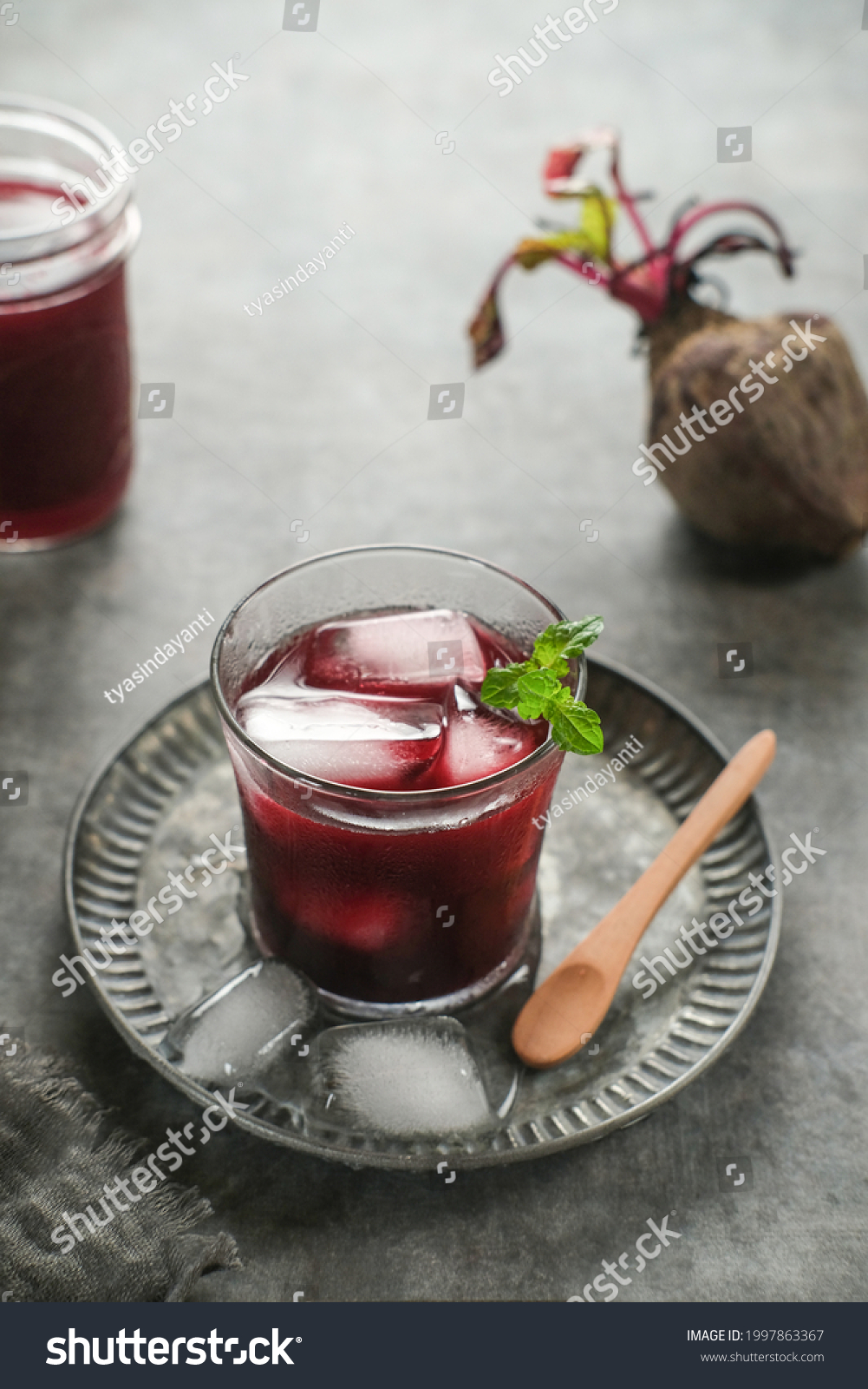 Healthy Beetroot juice, served in glass. Close up and copy space. Selective focus image, blurred backgroundd.
 #1997863367