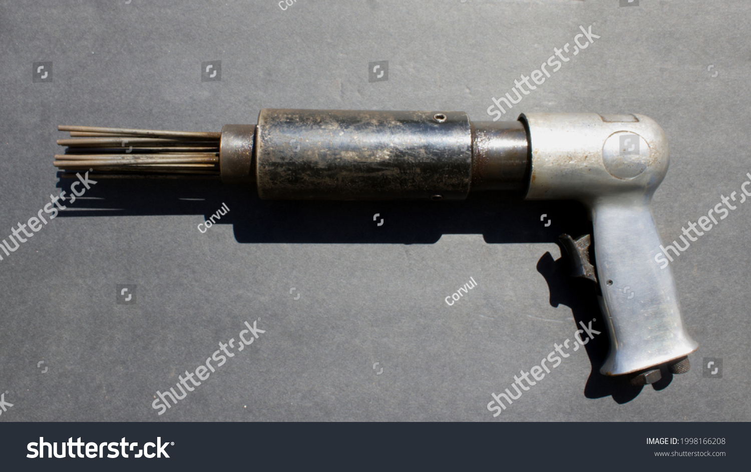 An Air Needle Scaler on a Black Background #1998166208
