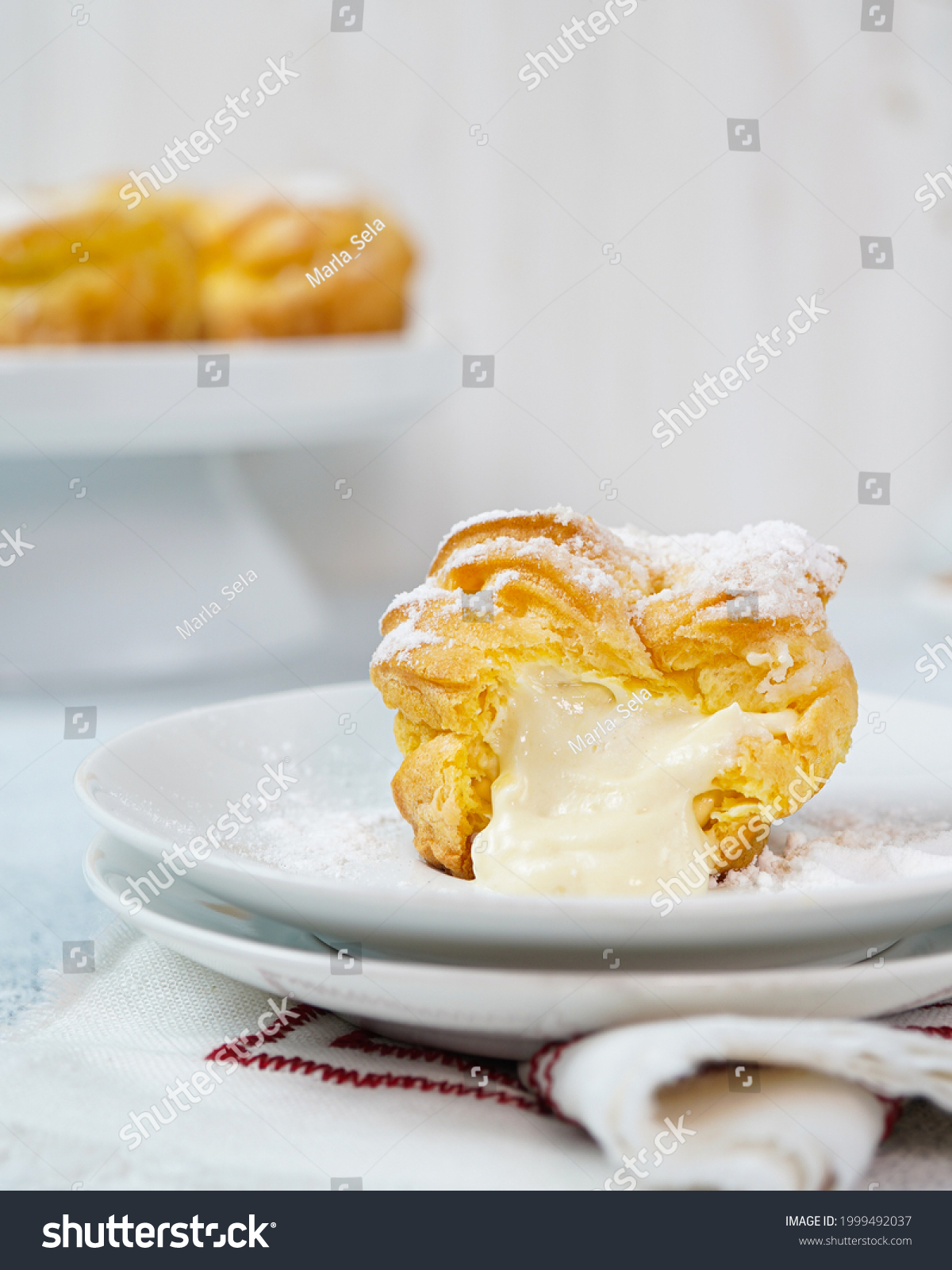 Melted cream,kue soes original,soes original or cream puffs or Choux Pastry Cream Puffs,pastry ball filled with whipped cream, crispy and airy choux pastry shells are filled with smooth and soft cream #1999492037