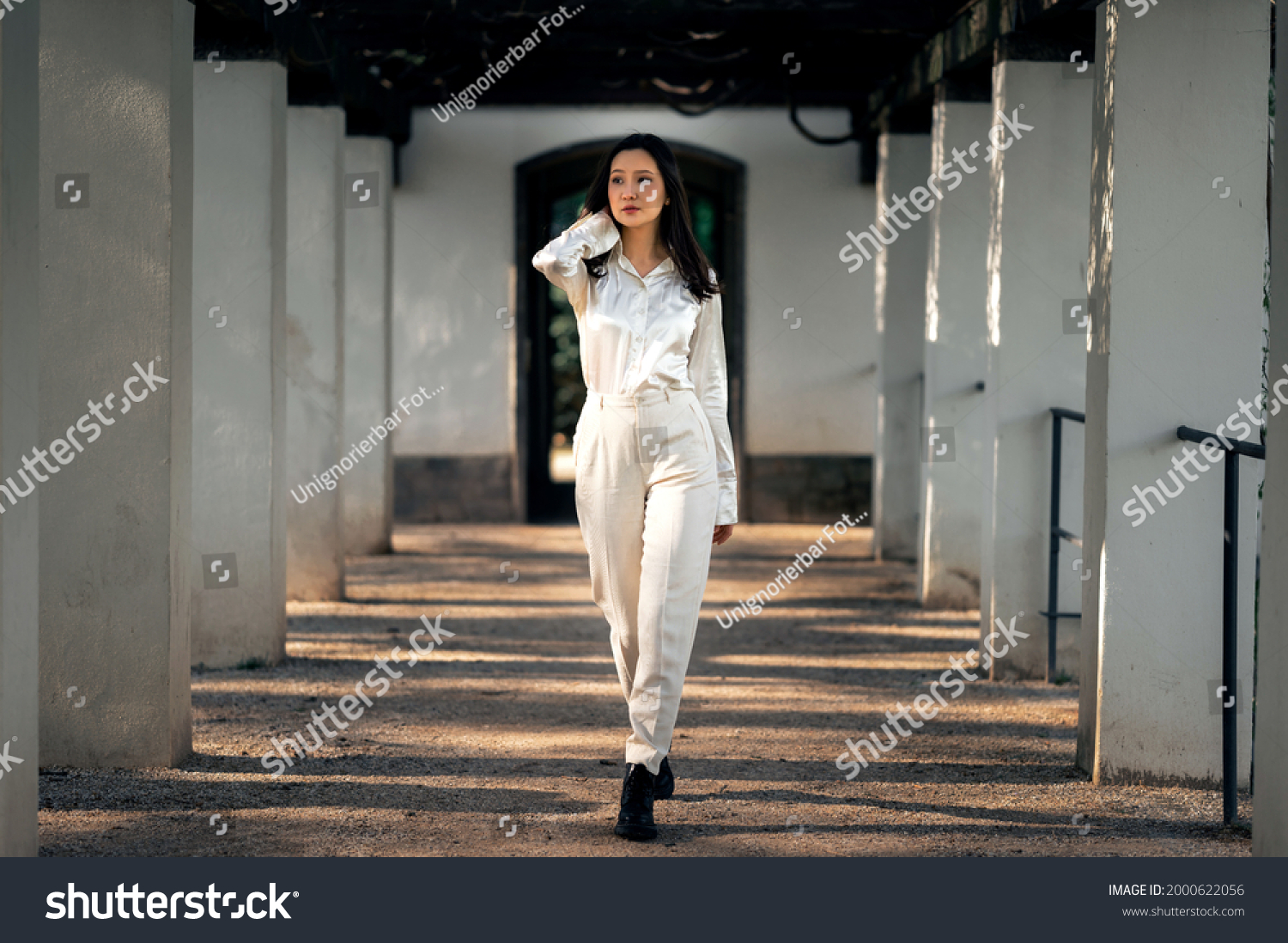 Asian girl with long black hair outdoor, asian woman in white clothes, lifstyle photo of woman in whine shirt and trousers outside, beautiful chinese woman in white outfit #2000622056