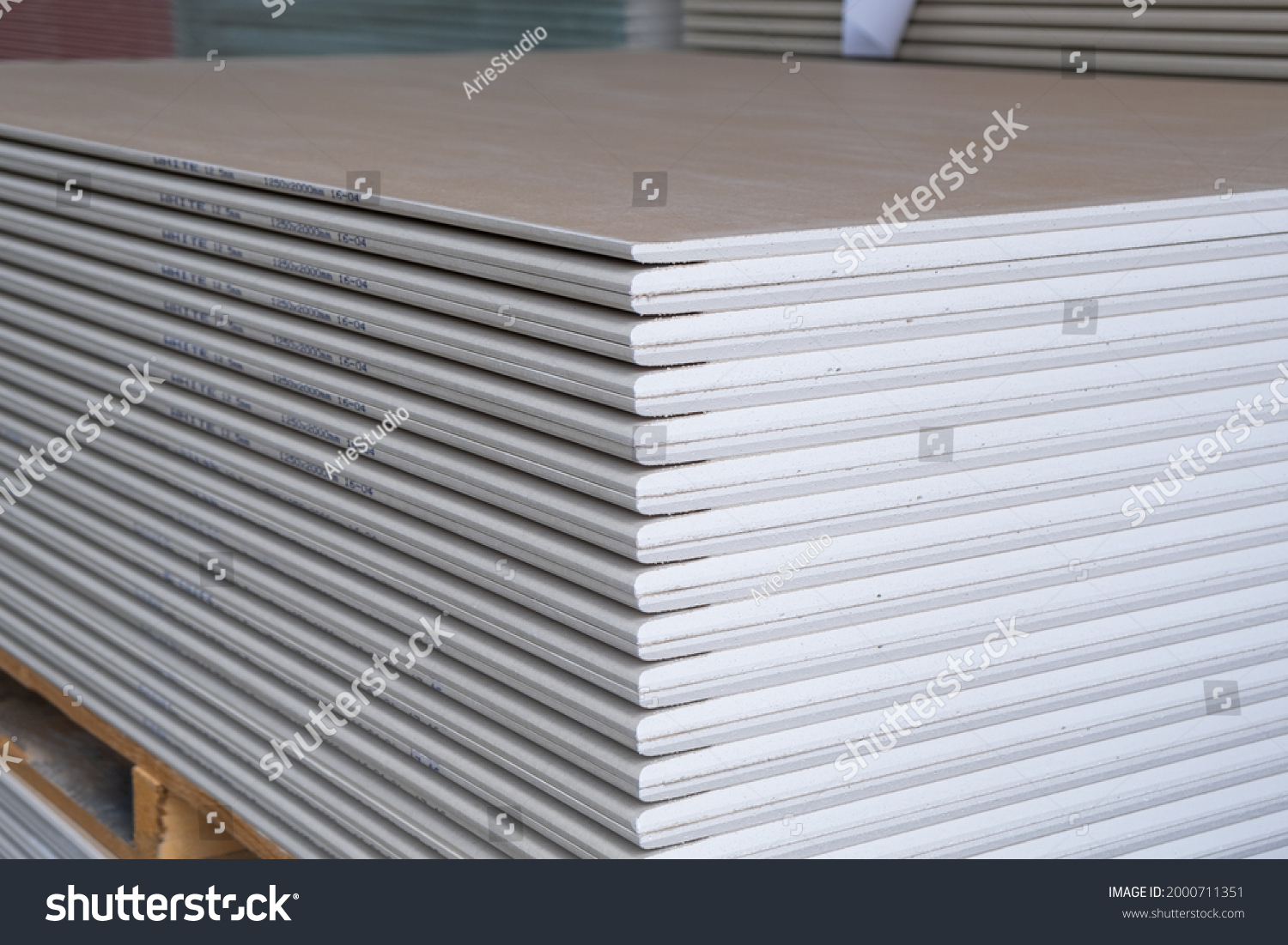 The stack of WHITE Standard Gypsum board panel. Plasterboard. Panel Type A designed for indoor walls, partitions and ceilings, construction site #2000711351