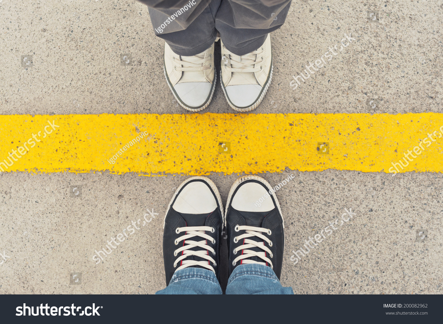 Top View of Sneakers from above, Male and female feet in sneakers, standing at dividing frontier line. #200082962