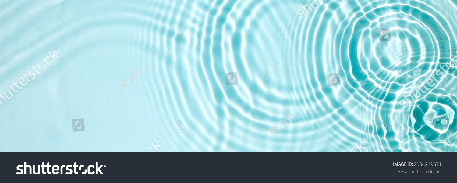 Blue water texture, blue mint water surface with rings and ripples. Spa concept background. Flat lay, copy space. #2004249671