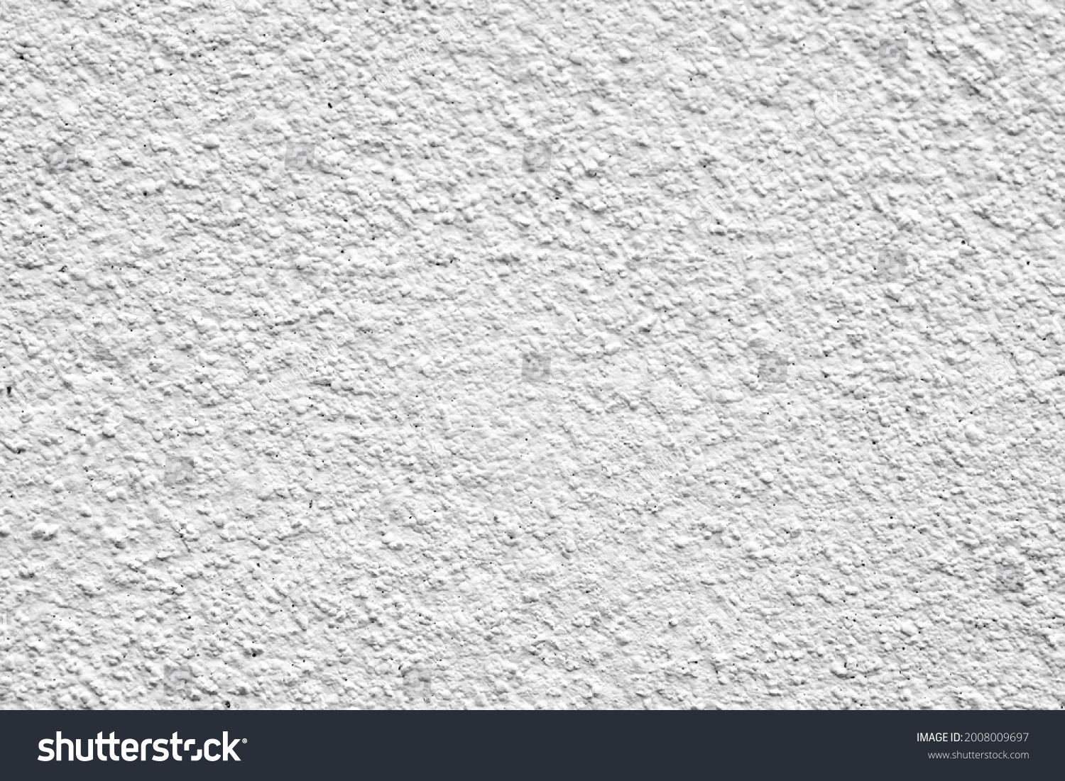 Rough surface of a concrete wall painted in greyish white, concrete wall background, blurred white background. #2008009697