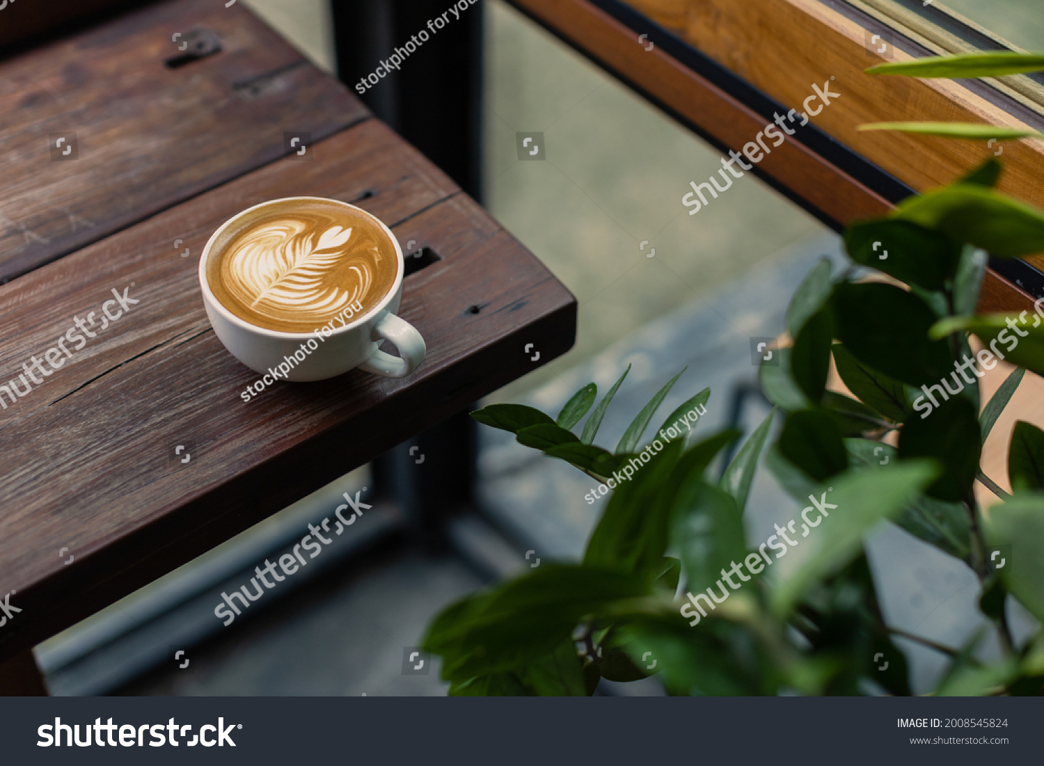 coffee latte on wood bar with coffee shop background #2008545824