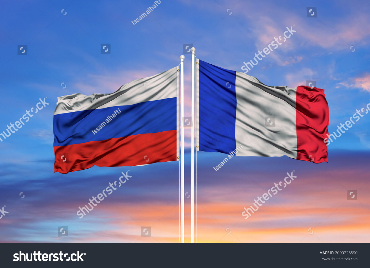 France and Russia two flags on flagpoles and blue cloudy sky #2009226590