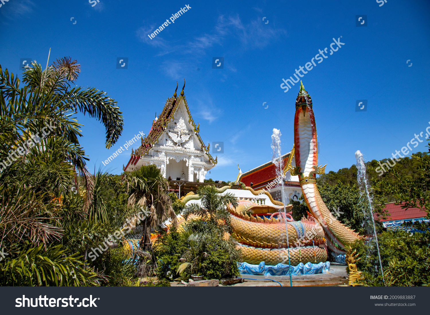 Wat Khao Sung Chaem Fa temple with giant snake and reclining gold buddha, in Kanchanaburi, Thailand #2009883887