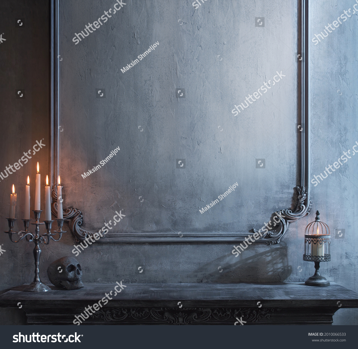 Mystical Halloween still-life background. Skull, candlestick with candles, old fireplace. Horror and witchery. #2010066533