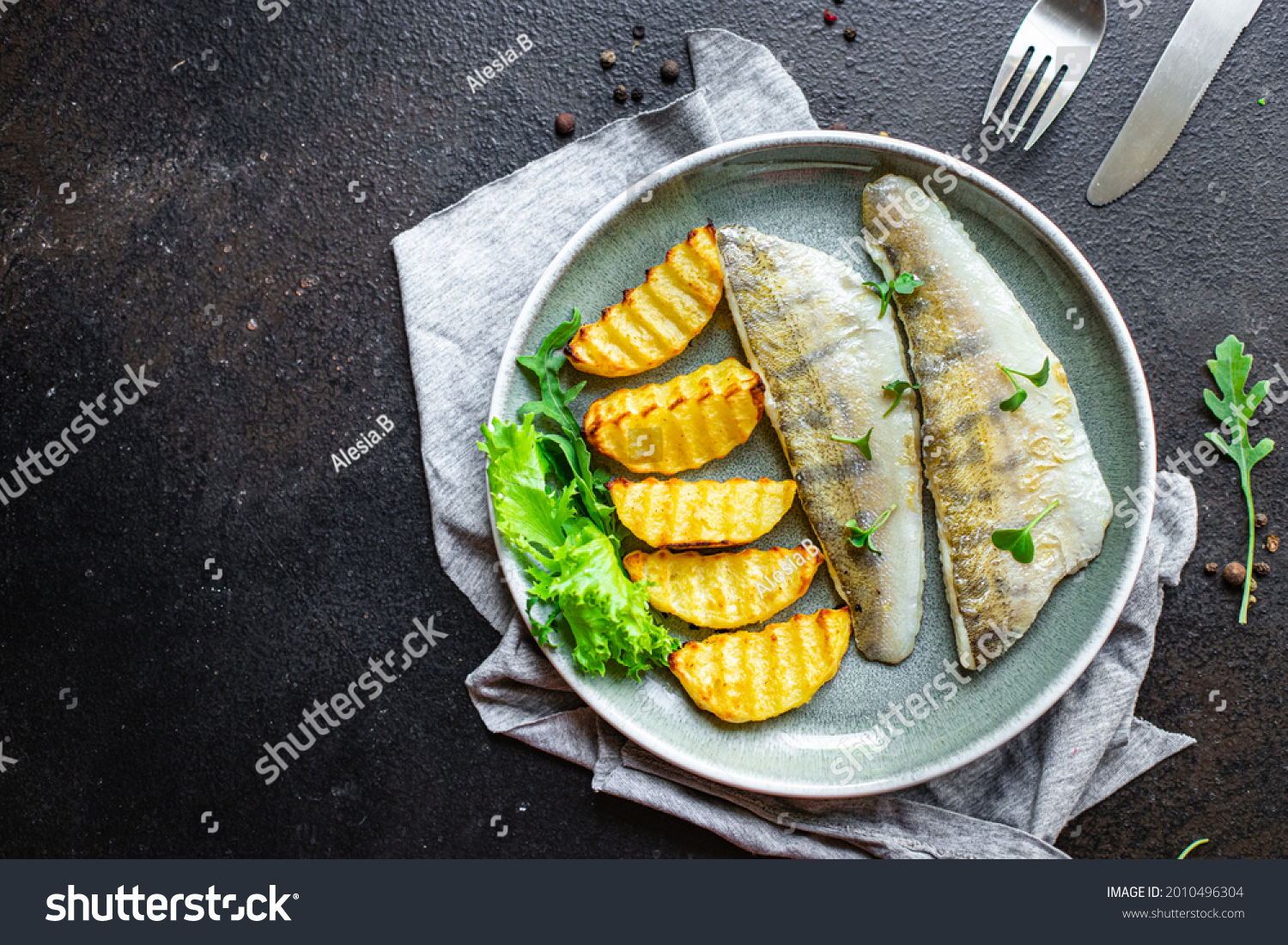 fried fish and potatoes pike perch fish fresh seafood food organic products meal snack copy space food background rustic. top view keto or paleo diet vegetarian food pescetarian diet #2010496304