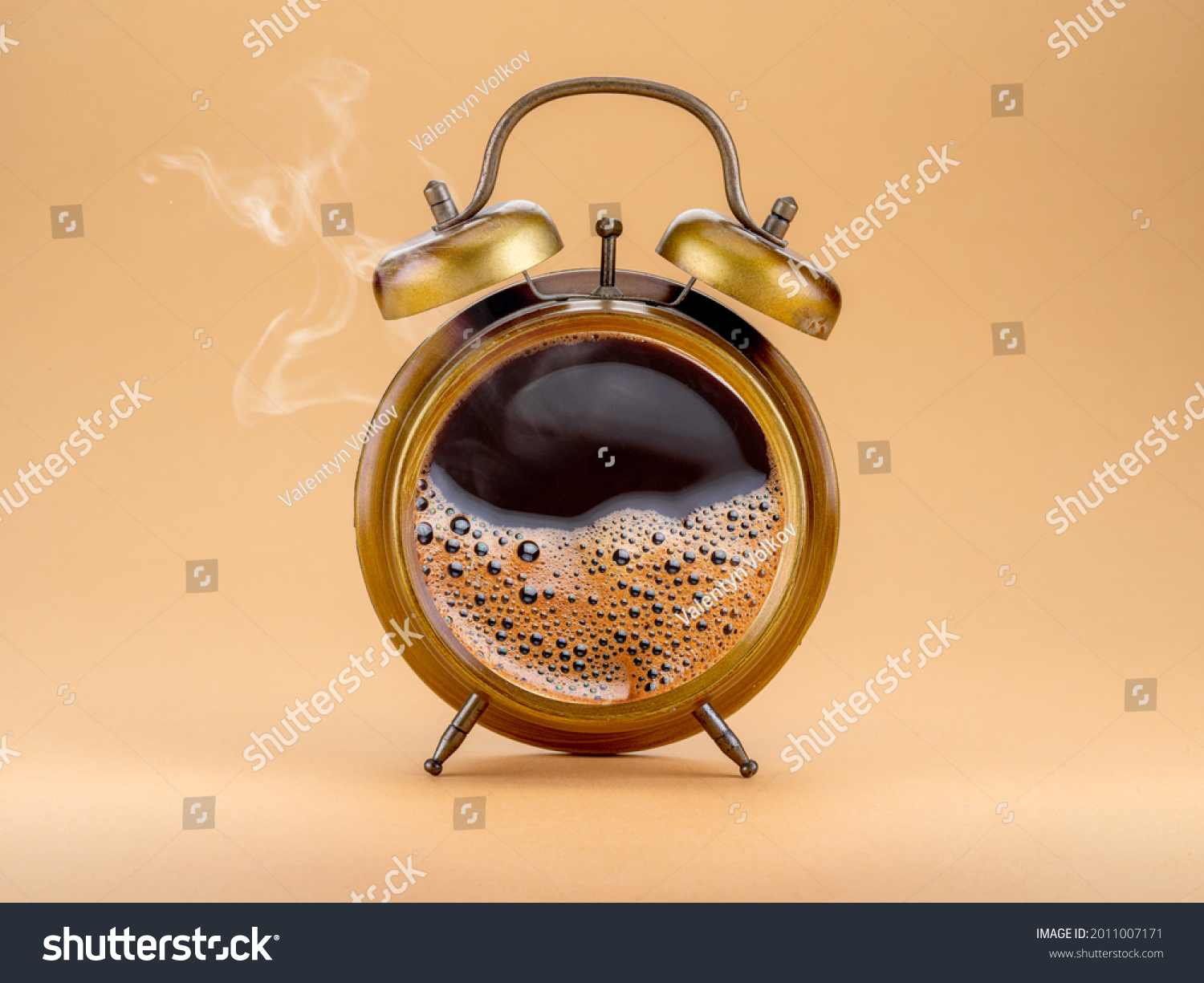 Steamy coffee drink collage. Hot coffee inside of a'larm clock as a symbol coffee time. #2011007171