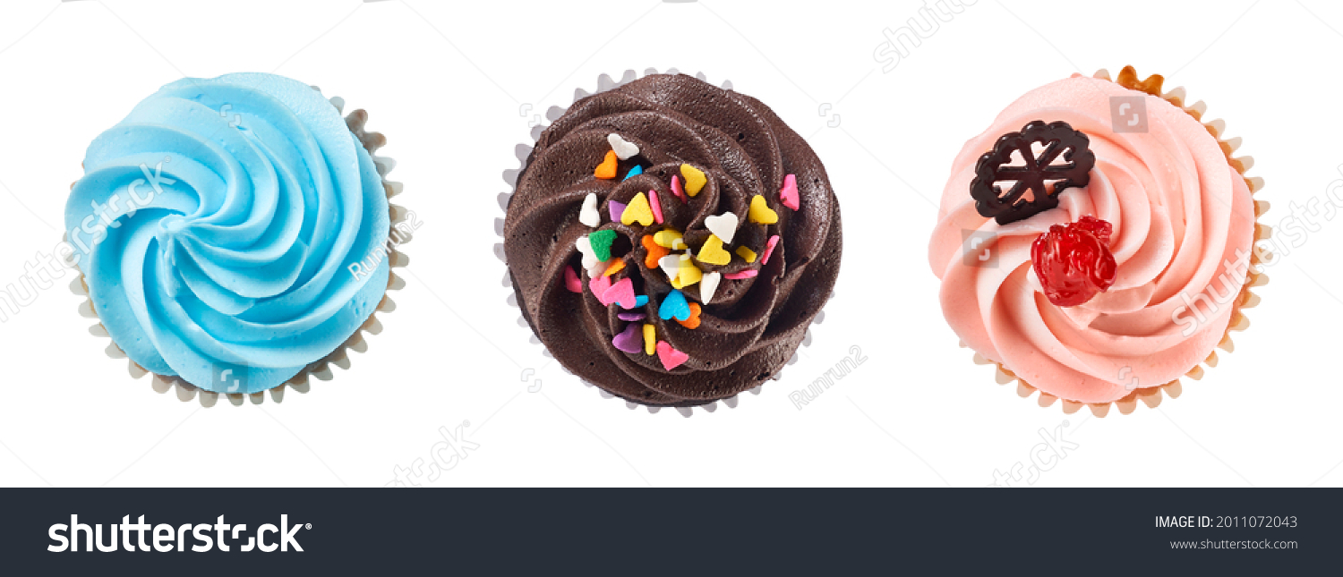 Top view of chocolate and vanila cream cupcakes isolated on white with clipping path #2011072043