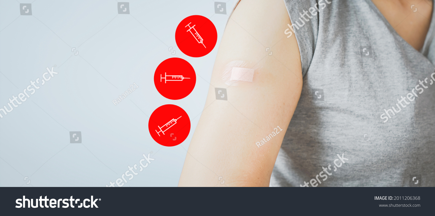 senior woman showing  her arm with bandage after got vaccinated or inoculation three dose or booster dose due to spread of corona virus, population, social or herd immunity concept
 #2011206368
