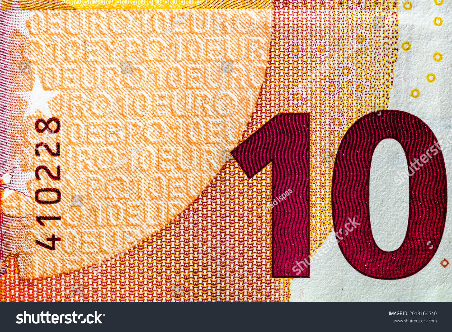 Selective focus on detail of EURO banknotes. Close up macro detail of EURO banknotes #2013164540