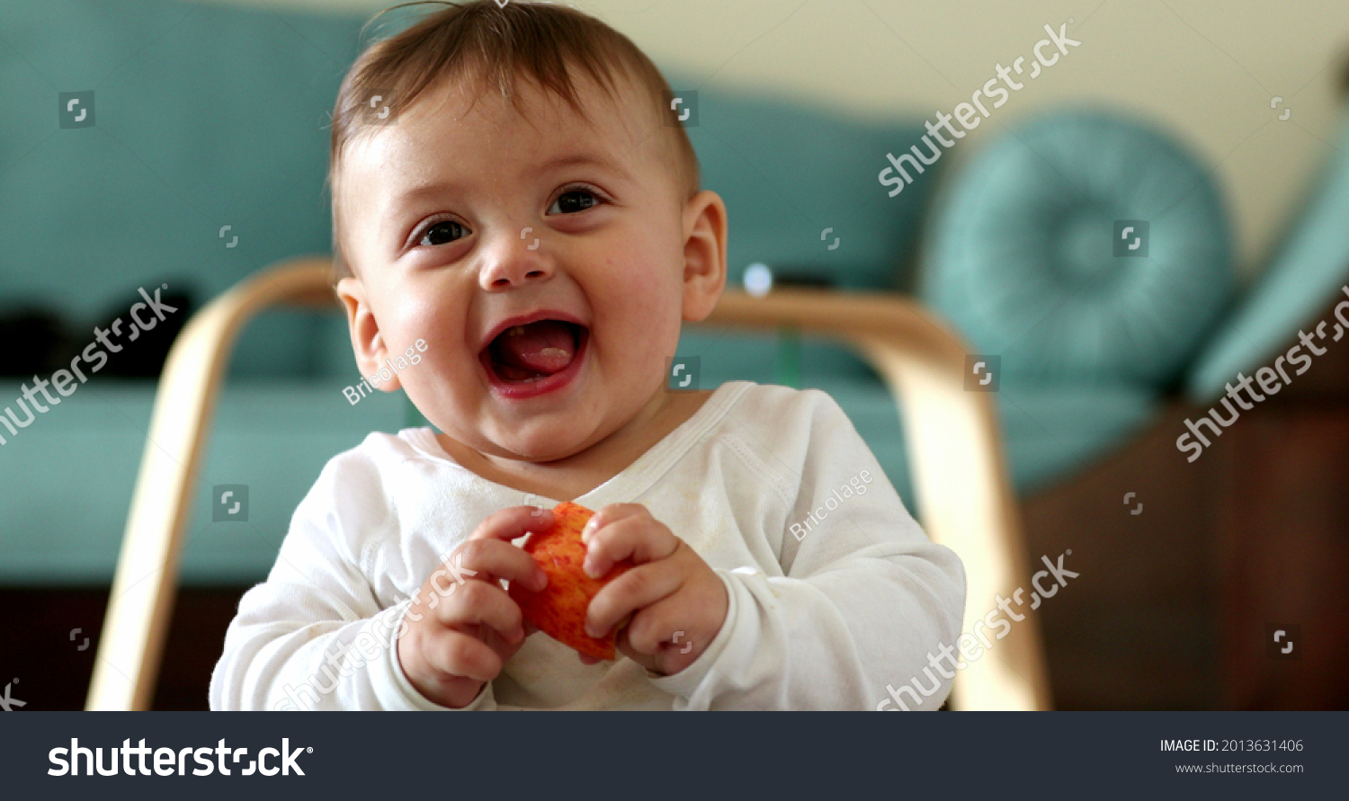 Adorable baby toddler face reaction, infant boy laughing and smiling #2013631406
