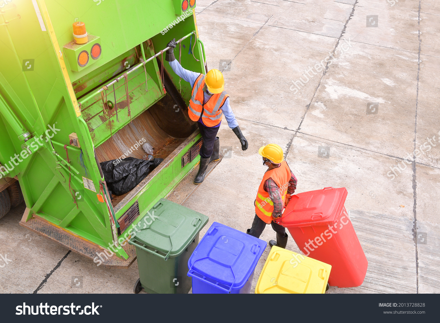 Workers collect garbage with Garbage collection truck,Garbage collection workers in residential area #2013728828