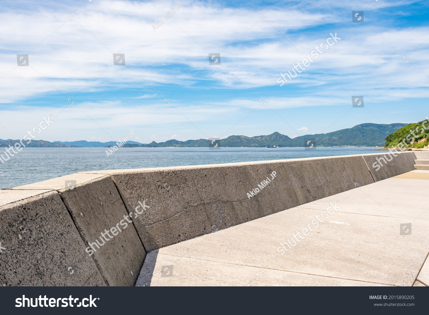 Beautiful Landscape of Seawall or Breakwater in The Blue Sea or Ocean in The Afternoon in Summer, Summer Vacation or Travel Background, Ogijima Island in Kagawa Prefecture in Japan, Nobody #2015890205