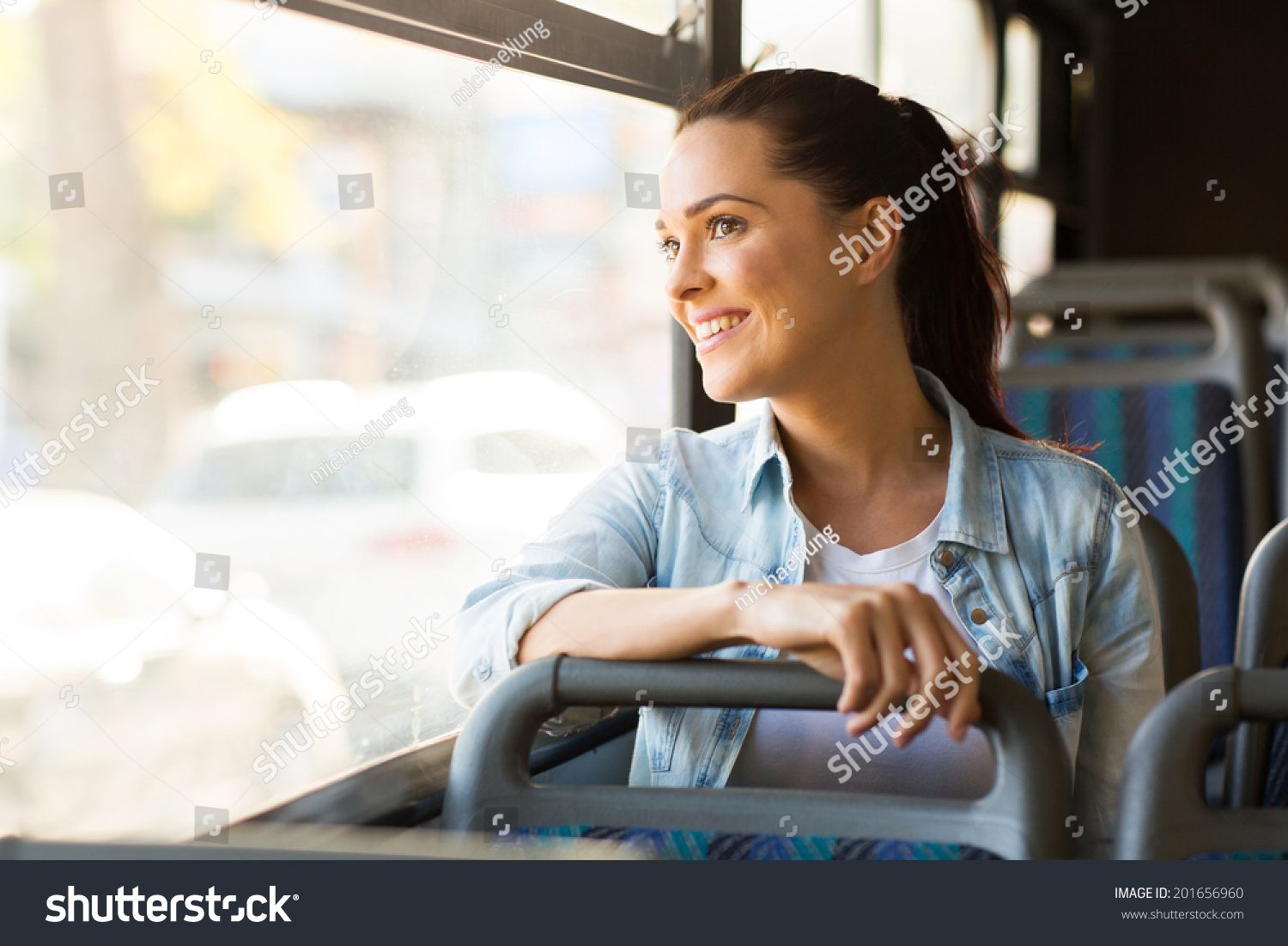 beautiful young woman taking bus to work #201656960