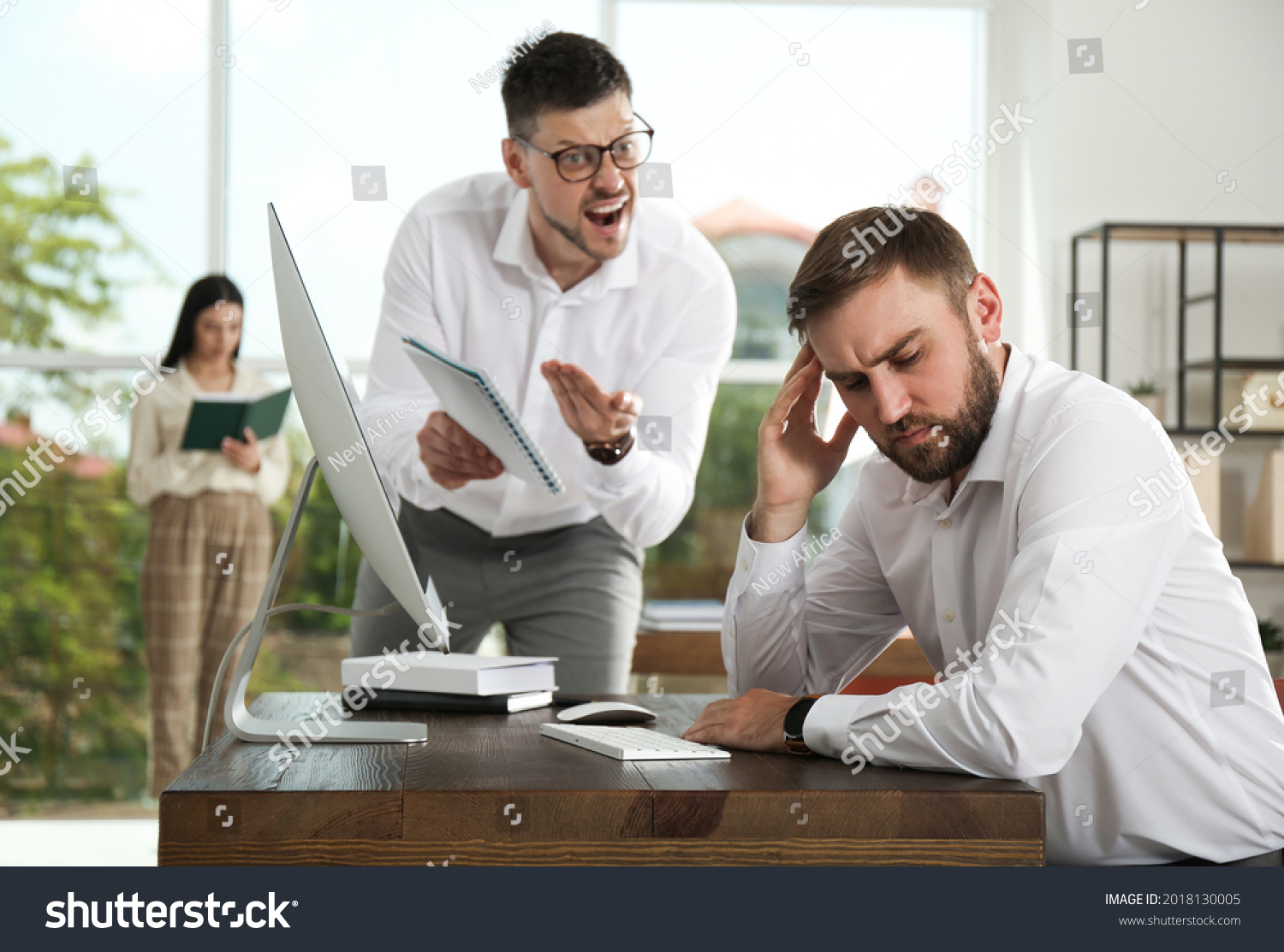 Boss screaming at employee in office. Toxic work environment #2018130005