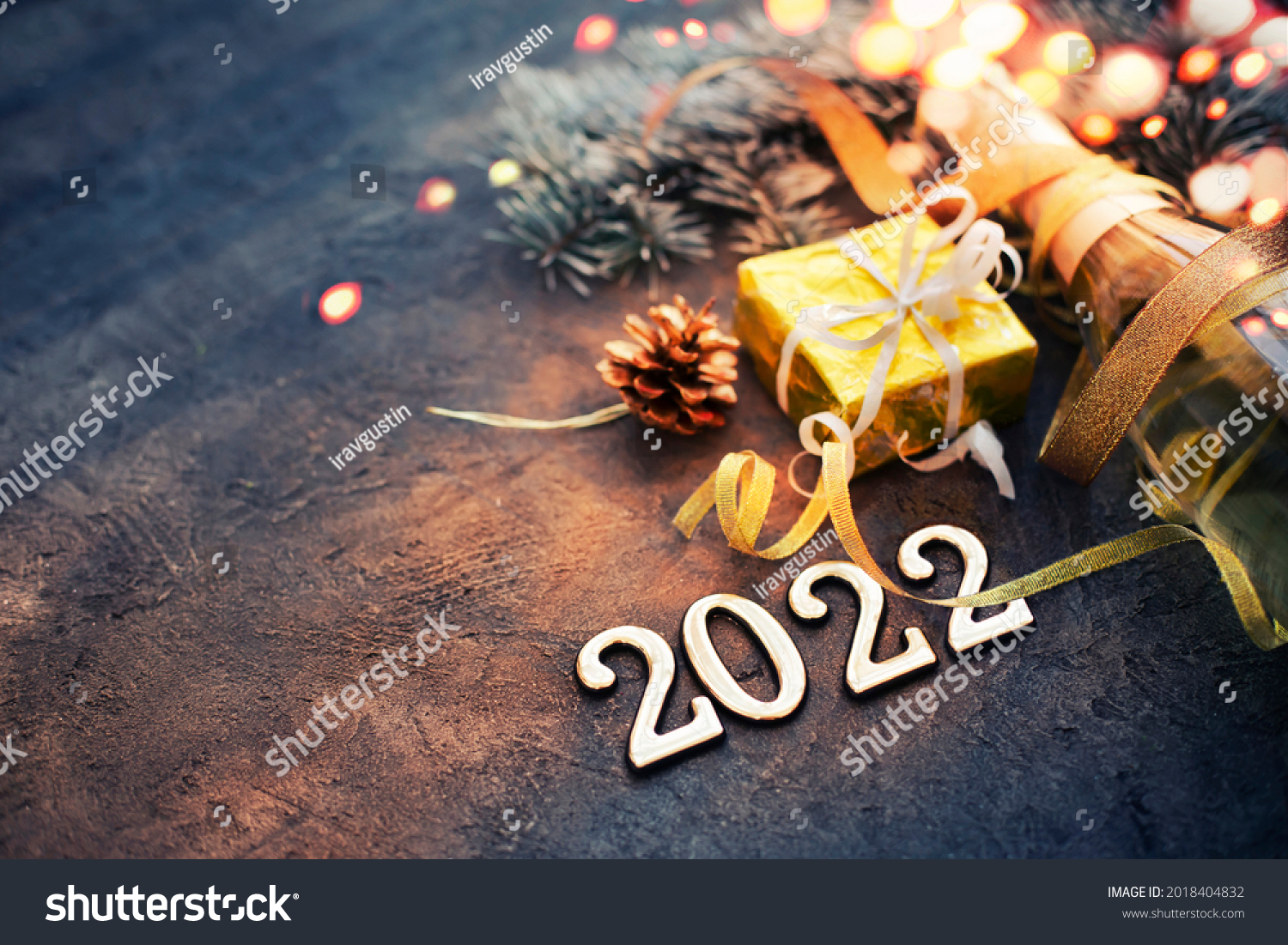 happy new year 2022  background new year holidays card with bright lights,gifts and bottle of сhampagne #2018404832