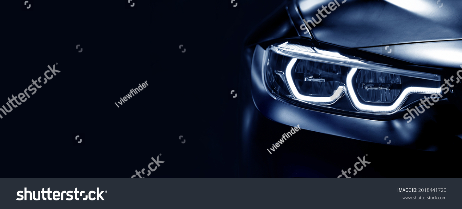 Detail on one of the LED headlights modern car on black background,	free space on left side for text. #2018441720