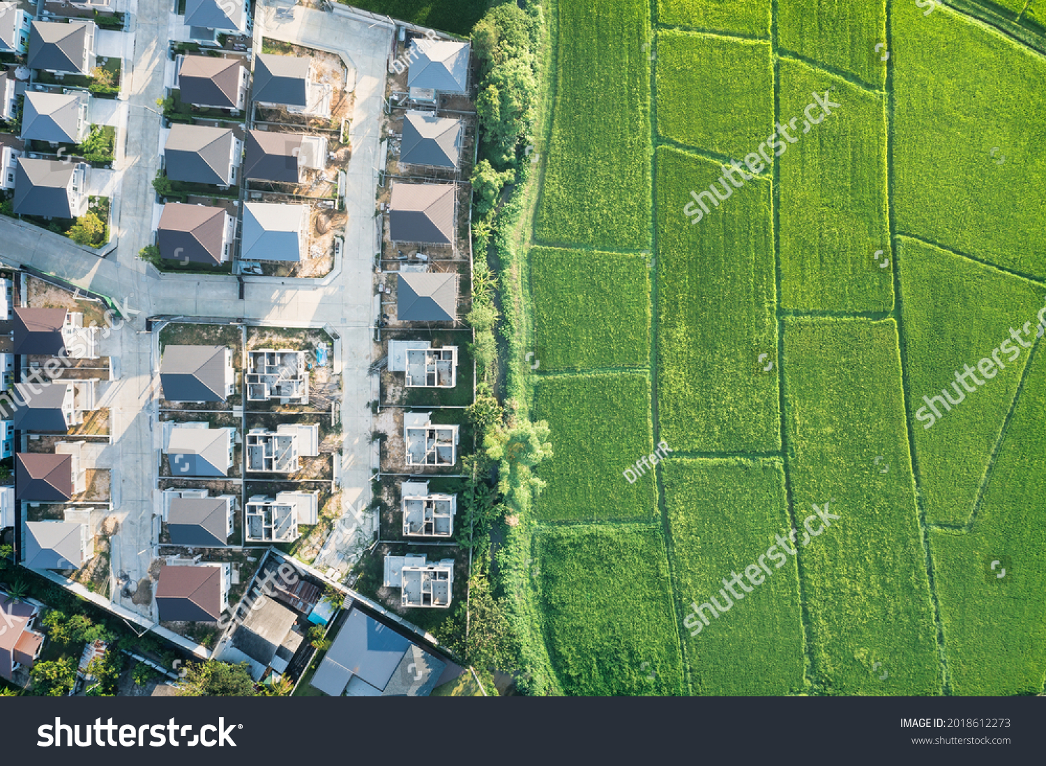 Land or landscape of green field in aerial view. Include agriculture farm, house building, village. That real estate or property. Plot of land for housing subdivision, development, sale or investment. #2018612273