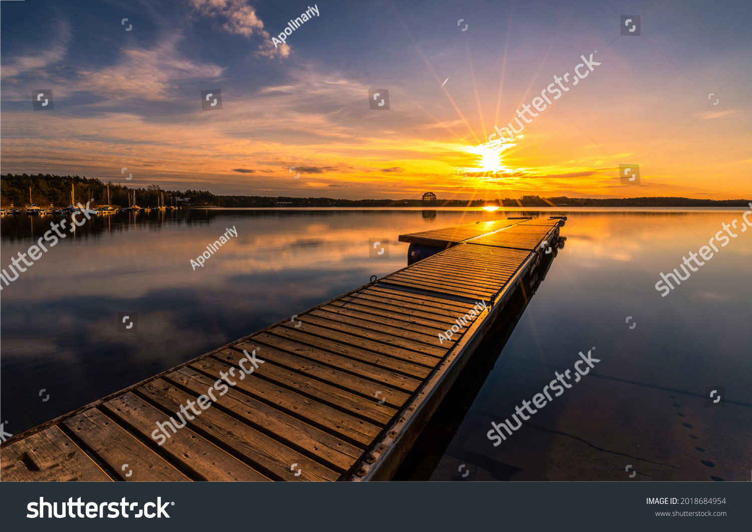 Lake pier at lighting sundown #2018684954