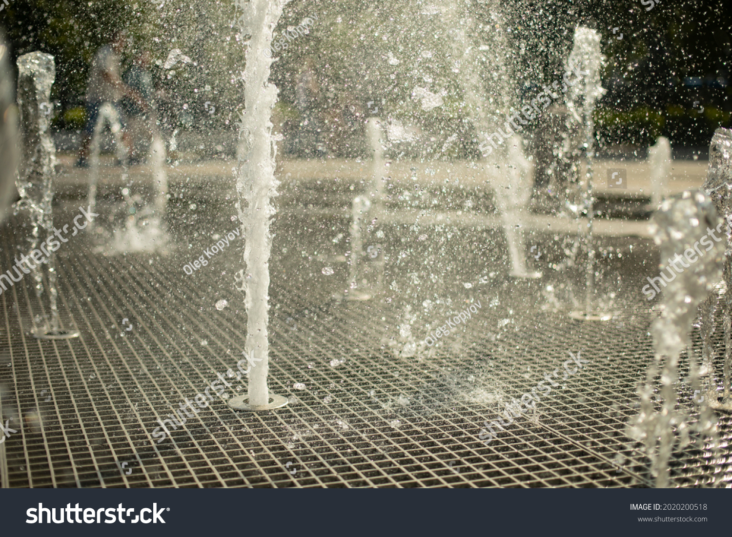 A fountain in the street. Water jets in the summer in the city. Splashing fountain on a sunny day. #2020200518