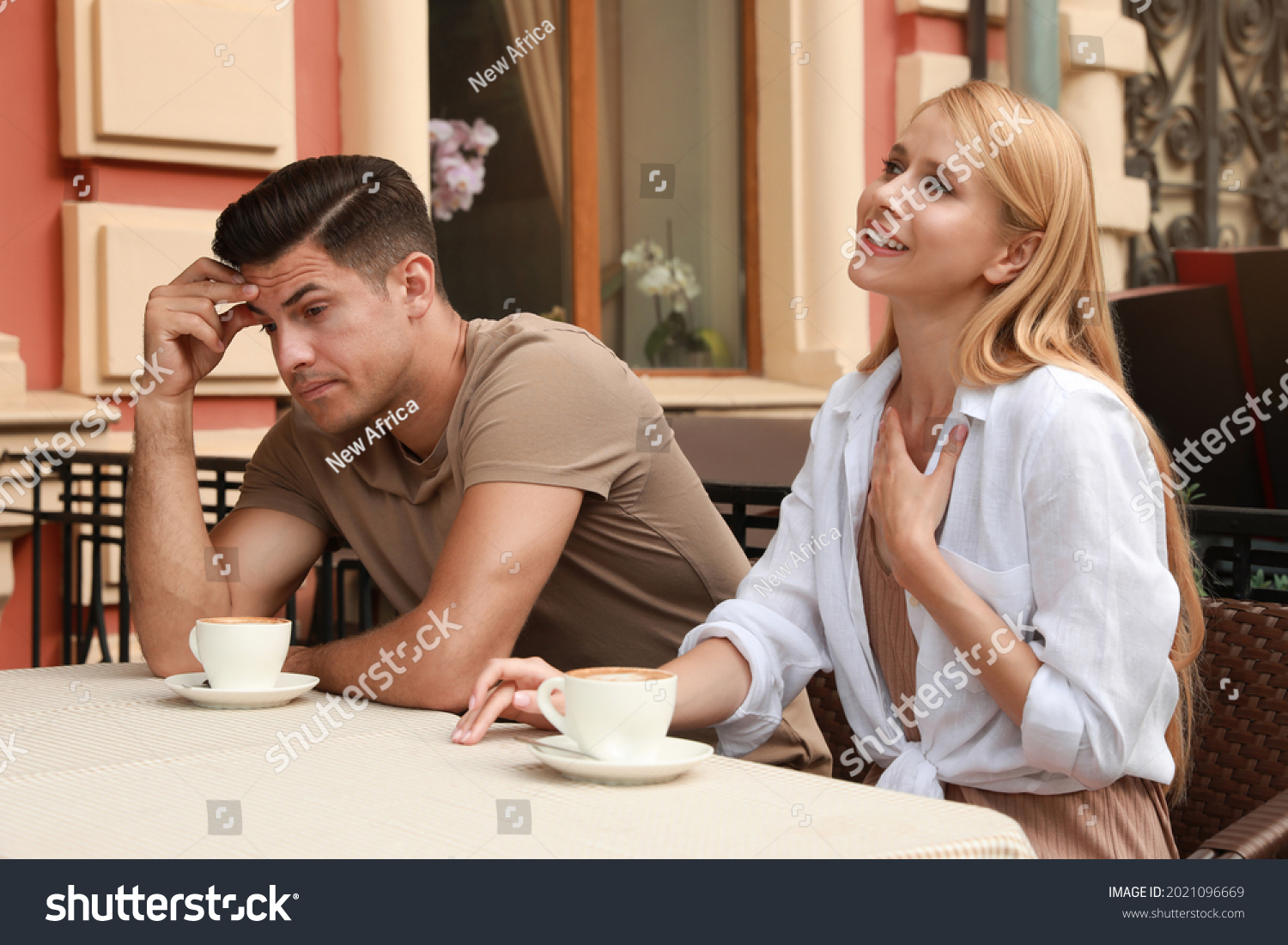 Man having boring date with talkative woman in outdoor cafe #2021096669