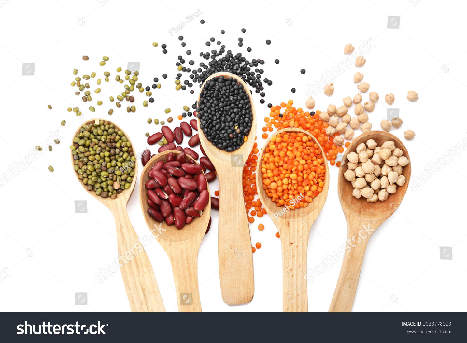 Spoons with different legumes on white background #2023778003