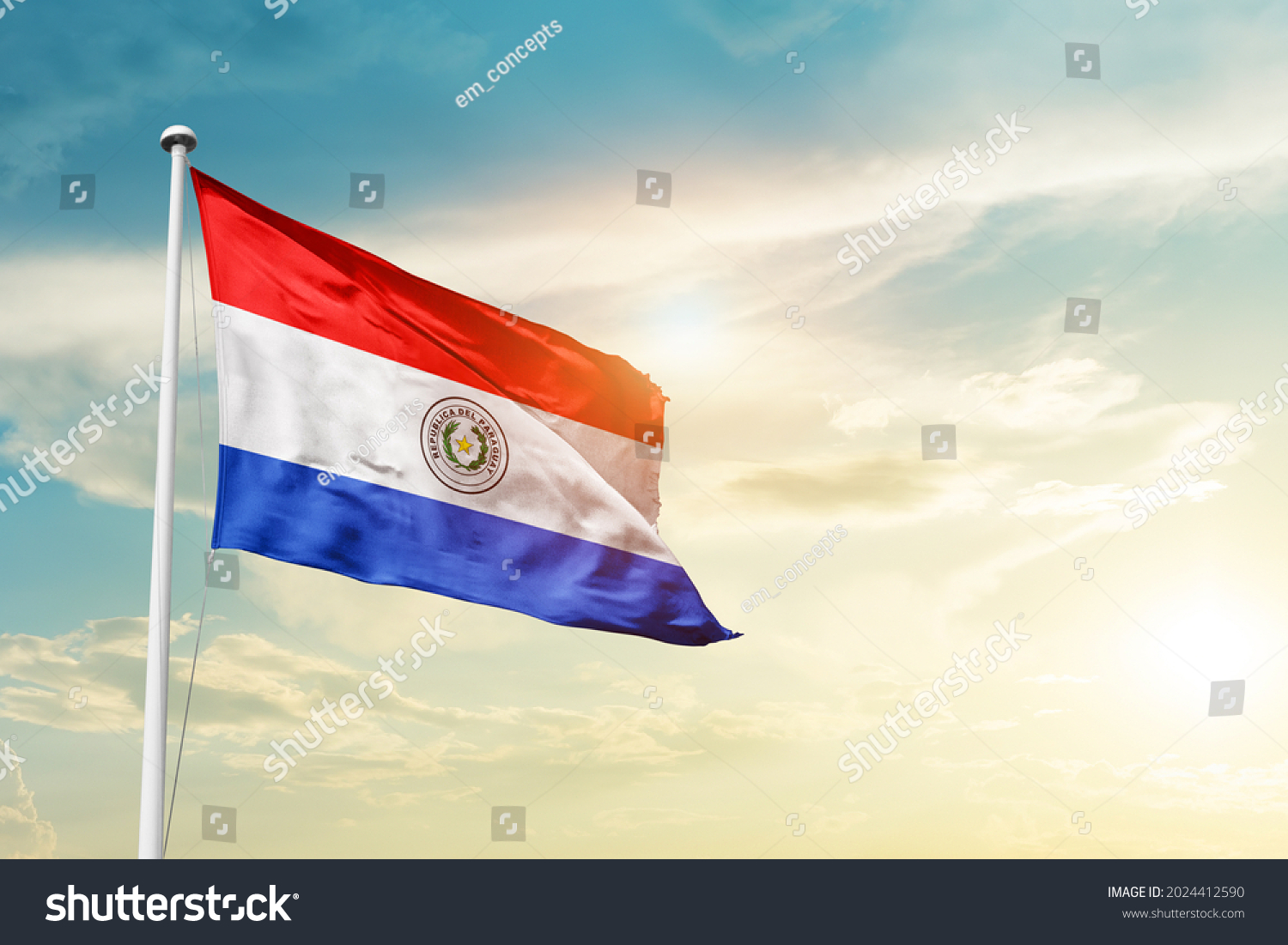 Paraguay national flag waving in beautiful clouds. #2024412590