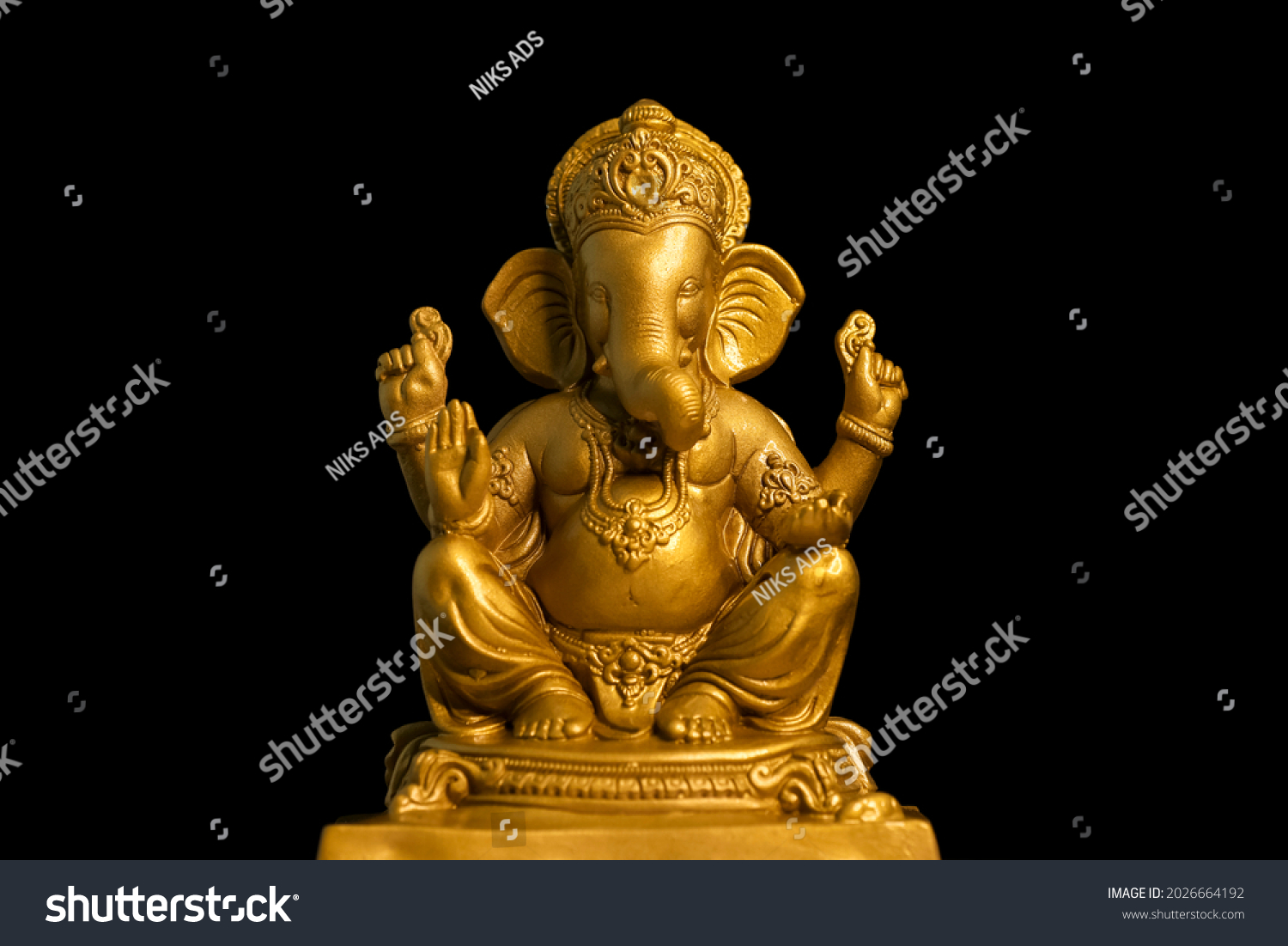 Golden lord ganesha sclupture over dark background. celebrate lord ganesha festival. #2026664192