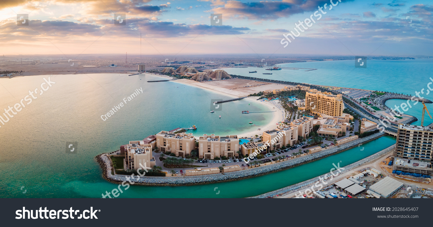 Panoramic view of Marjan Island seafront reclaimed land artificial island in emirate of Ras al Khaimah in the United Arab Emirates aerial view at sunrise #2028645407