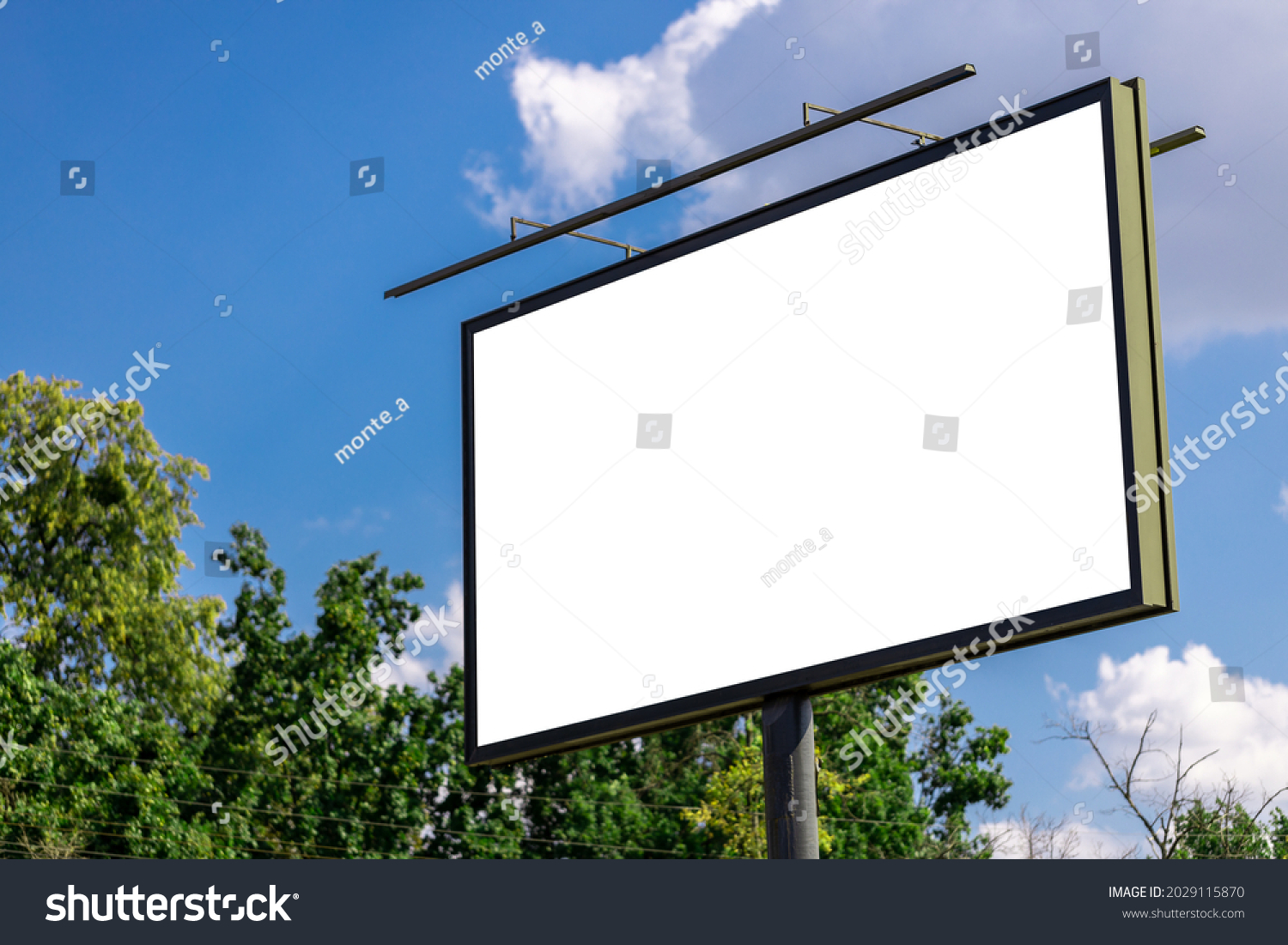 blank advertising billboard mockup. urban life. near park area. template for design. large advertising road banner. #2029115870