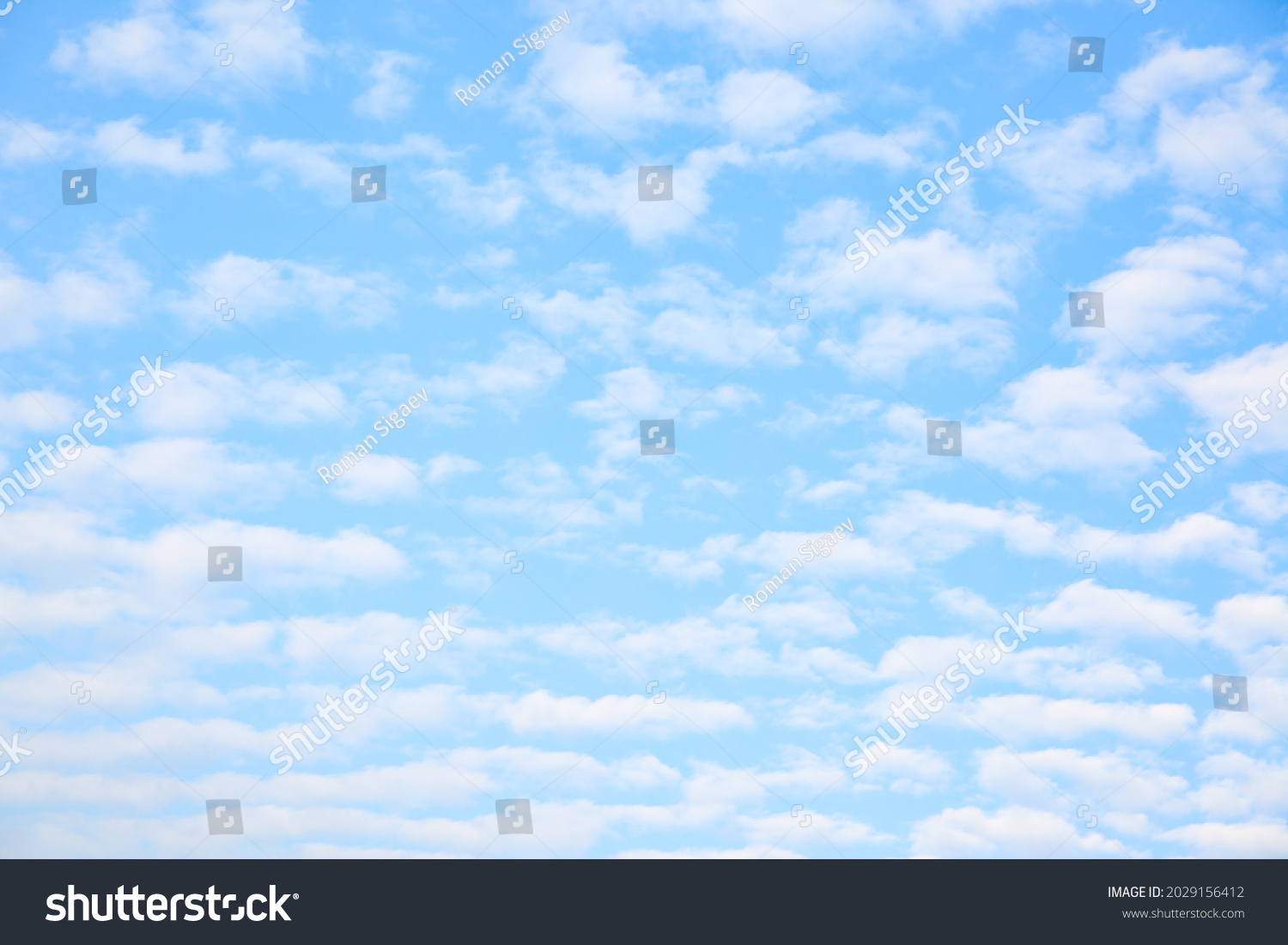 Multitude white small clouds in the sky , may be used as background #2029156412