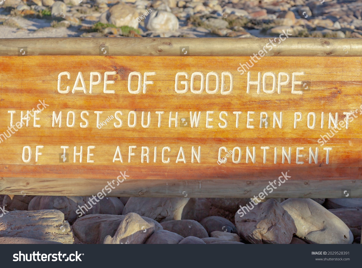 Cape of Good Hope the south-western most point of the African continent - an inscription on  wooden shield on the shore of the cape near the water.  An nformation sign about   geographical point  #2029528391
