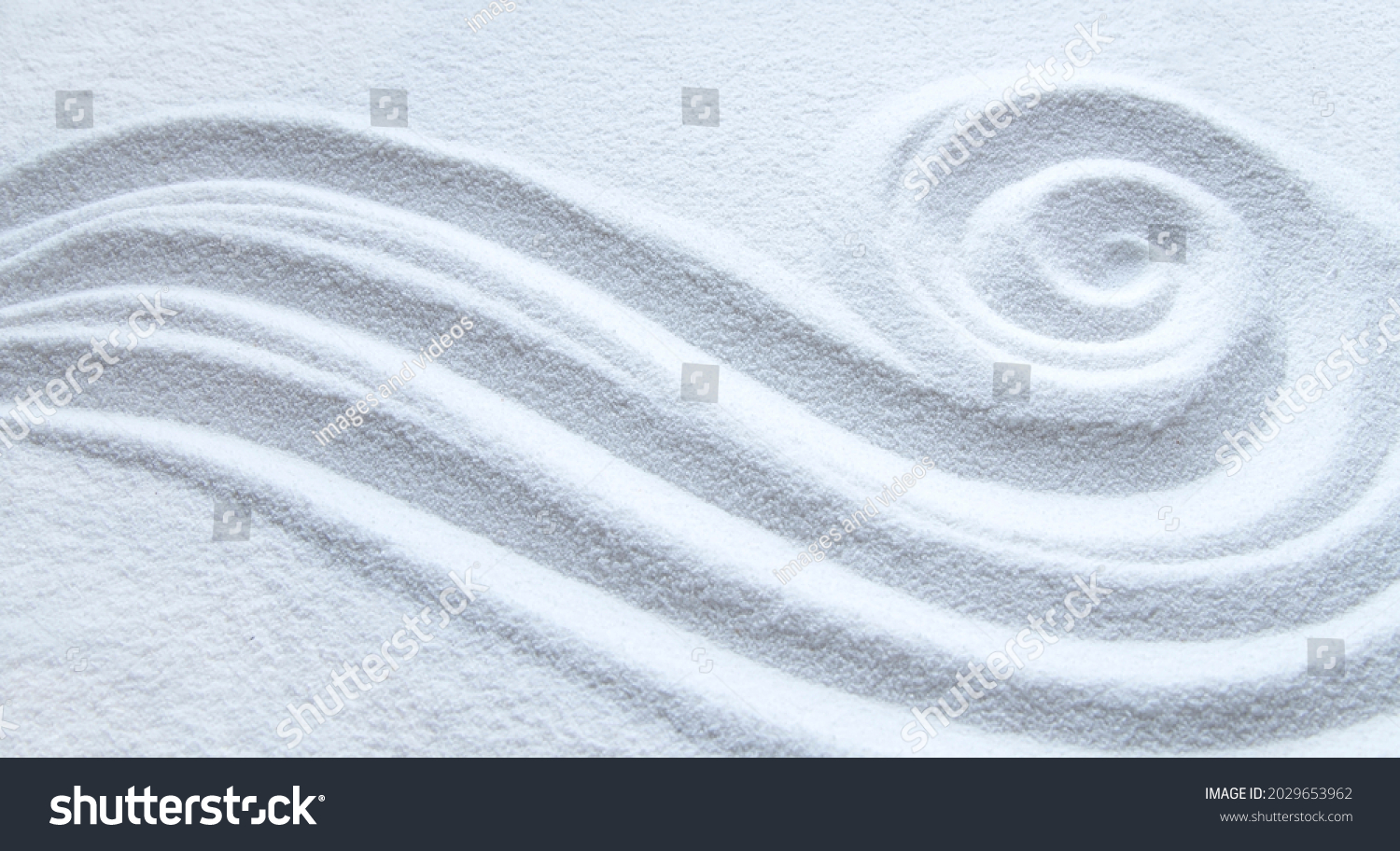 Spiral pattern in white sand #2029653962