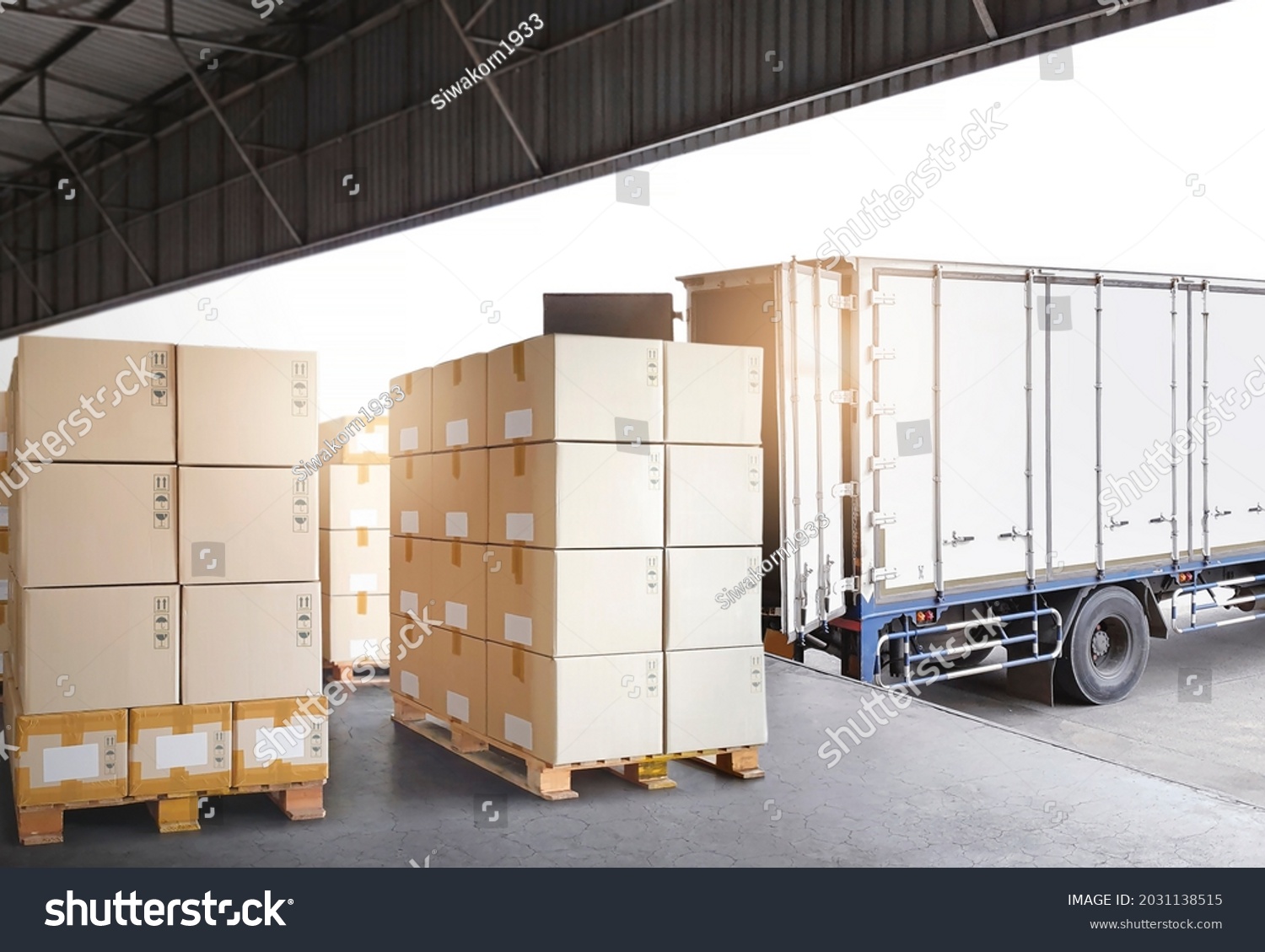 Industry Cargo Freight Trucks Transport Logistics. Shipping Cargo Container Trucks Parked Loading Packagin Boxes at Dock Warehouse. Supply Chain. Distribution Warehouse Center. Shipment Boxes. #2031138515