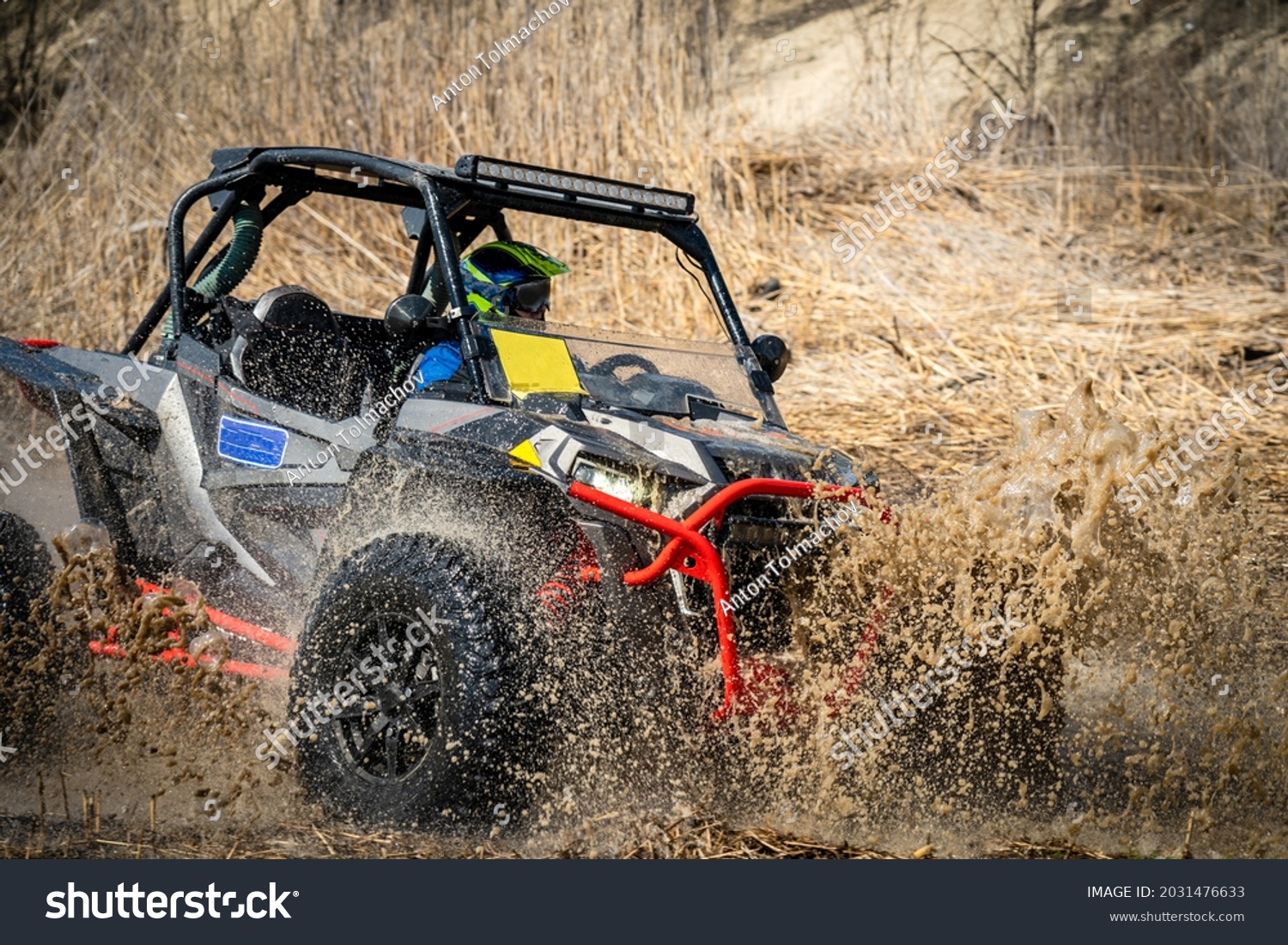 Active ATV and UTV Off-Road vehicle in muddy water. ATV 4x4 #2031476633