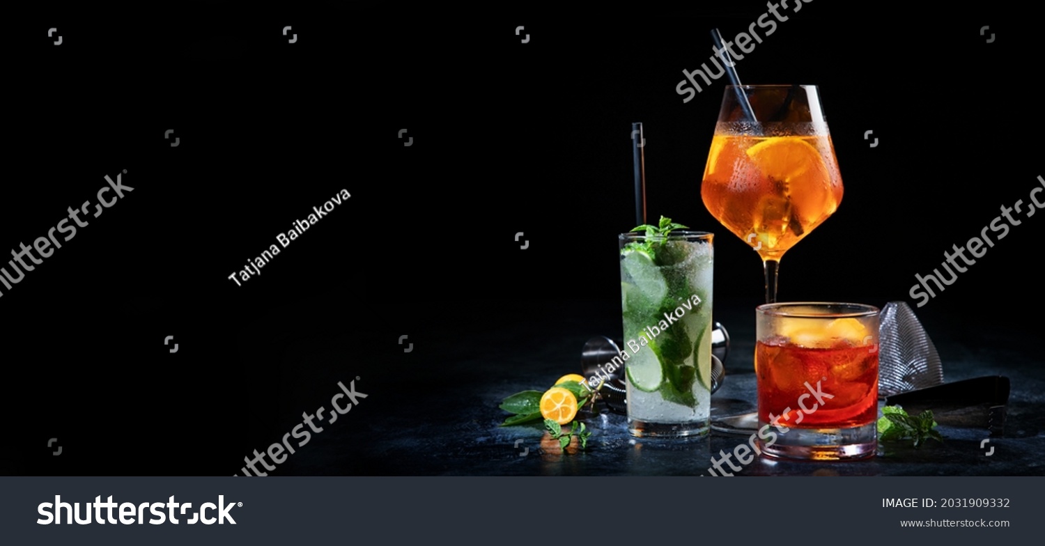 Cocktails assortment served on dark background. Classic drink menu concept. Copy space, panorama #2031909332
