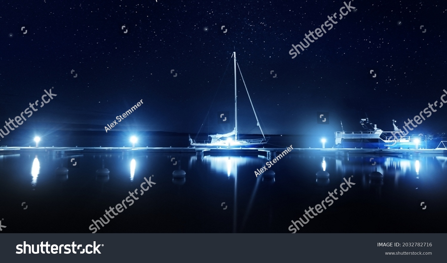 Blue sloop rigged yacht moored to a pier in marina at night. Clear twilight sky, stars, starlight, moonlight, lots of lights. Concept landscape. Copy space, graphic resources. Stockholm archipelago #2032782716