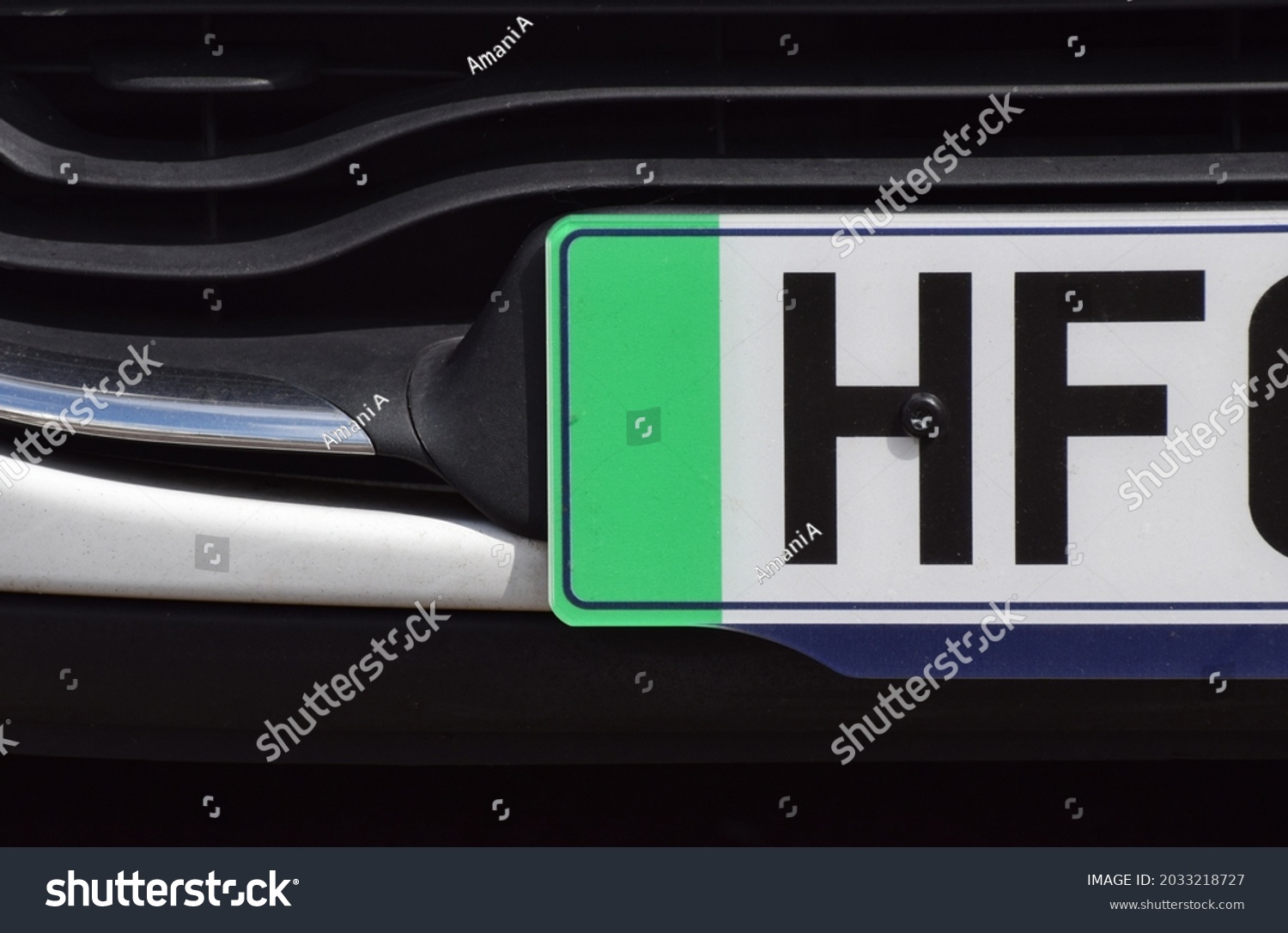 The green strip on a British car front number plate that denotes the car is a zero emissions vehicle #2033218727