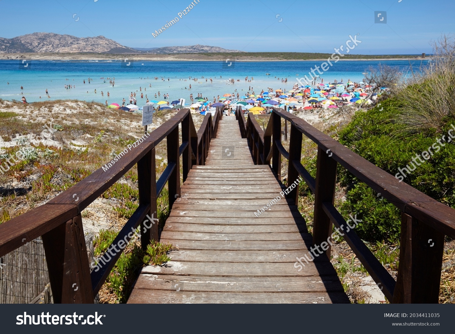 Footbridge to the beach of La Pelosa in Stintino, Sardinia, Italy #2034411035