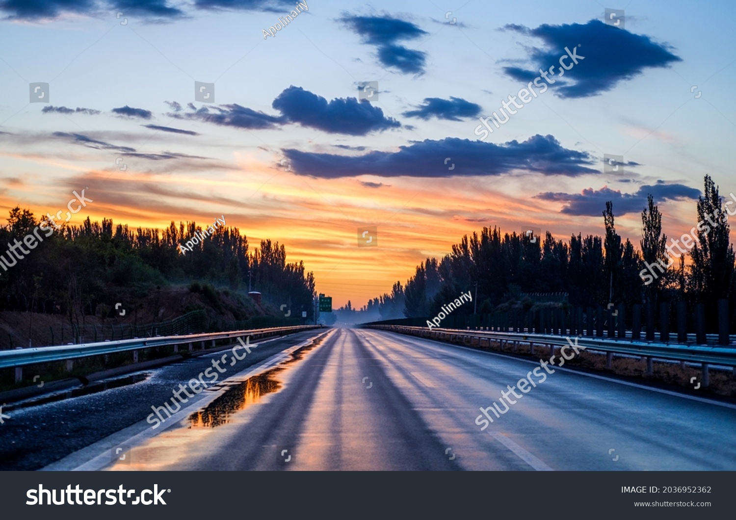 Sunrise over highway road at dawn #2036952362