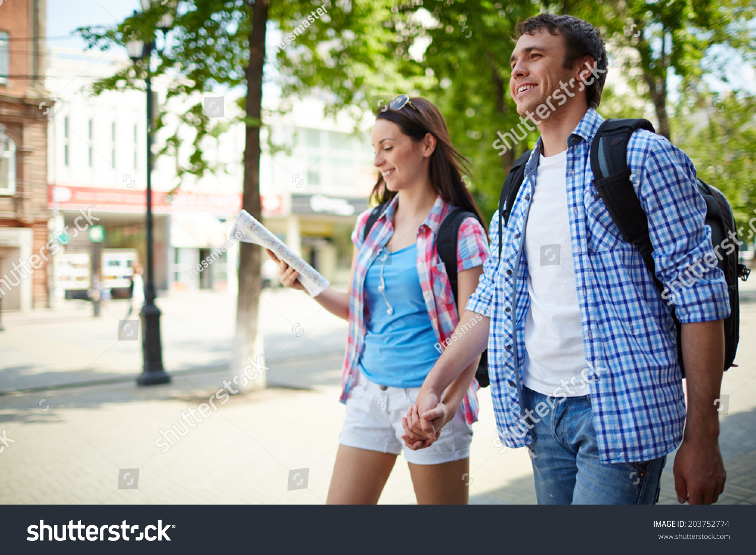 Couple of young travelers taking walk during journey #203752774
