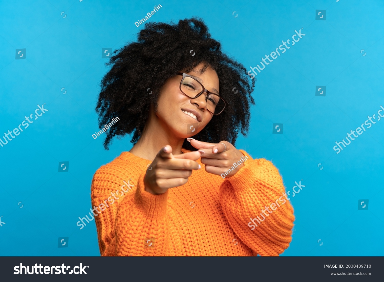 You what we need: excited african woman choosing you and gesturing point fingers front. Happy black female directing to camera, wink and bite lip. Career development, job offer and join team concept #2038489718