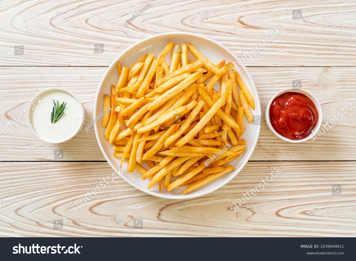 French fries or potato chips with sour cream and ketchup #2038644611
