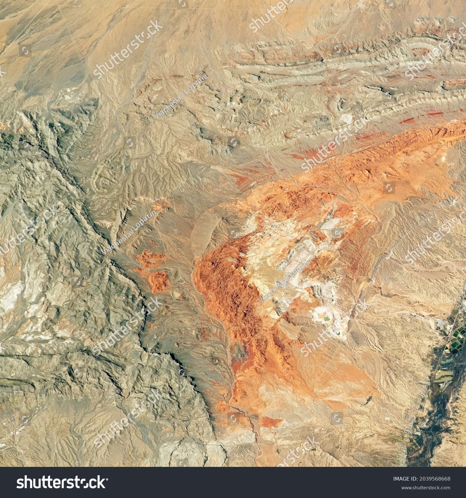 Desert land on satellite picture, aerial top view of terrain, physical map as abstract texture background. Theme of nature pattern, photo and topography. Elements of this image furnished by NASA.  #2039568668