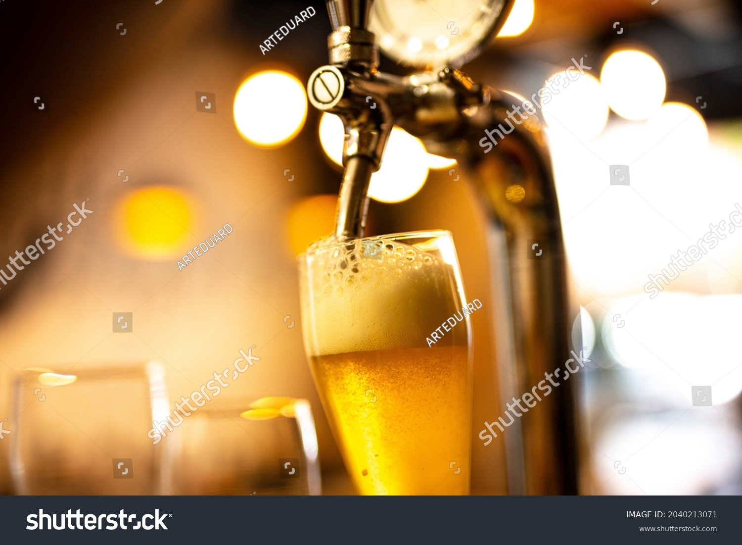 The beer taps in a pub. Alcohol concept.  Pouring beer for client.  #2040213071