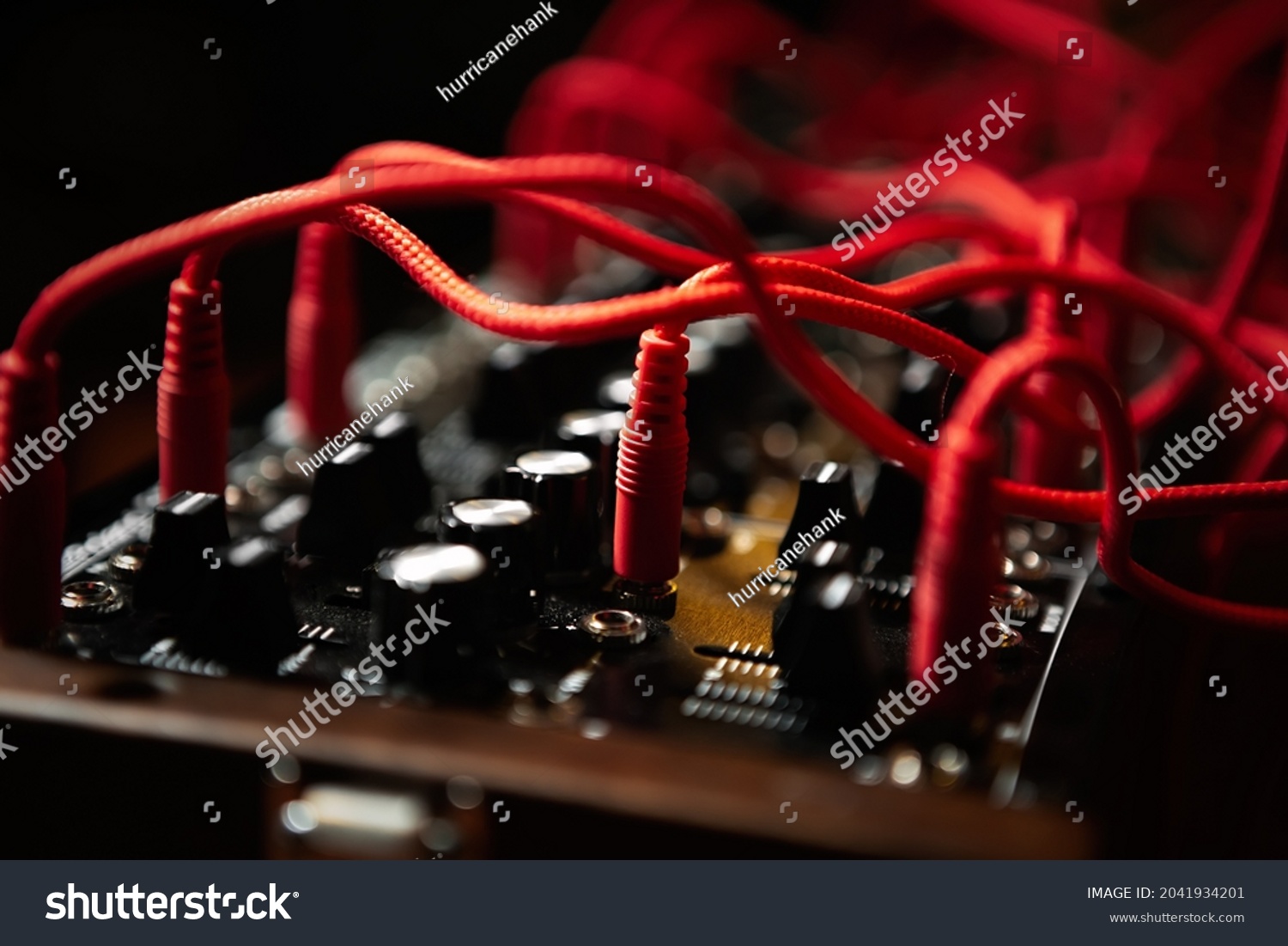 Analog synthesizer with audio cables. Professional modular synth device for electronic music production in sound recording studio #2041934201